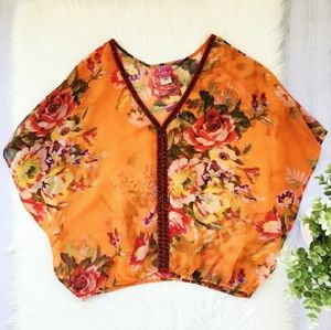 Free People sheer orange floral beaded top.